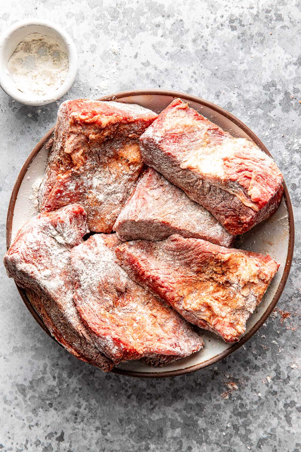 seasoned brisket pieces before searing