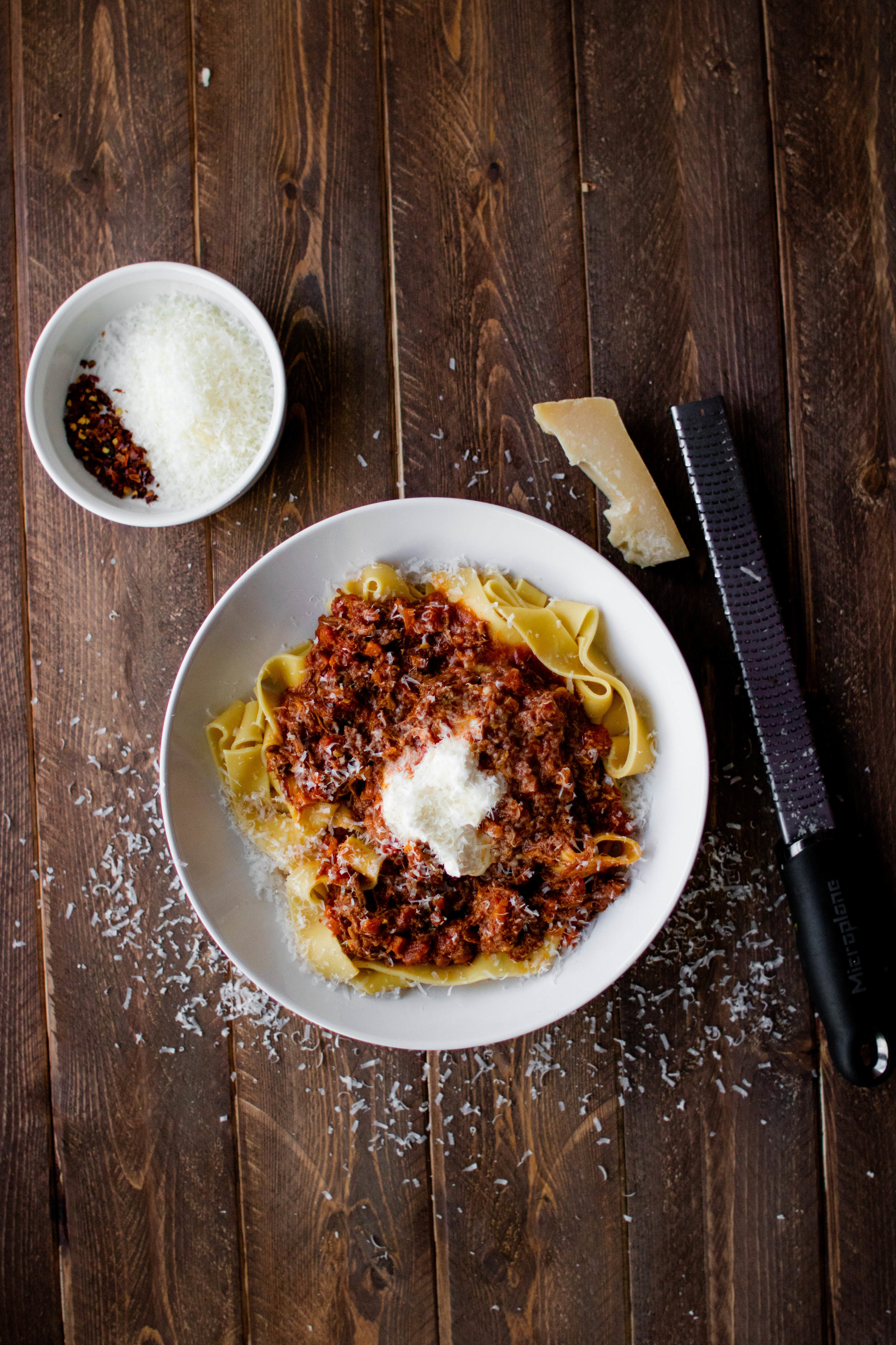 instant pot beef ragu and pappardelle in a white pasta bowl 