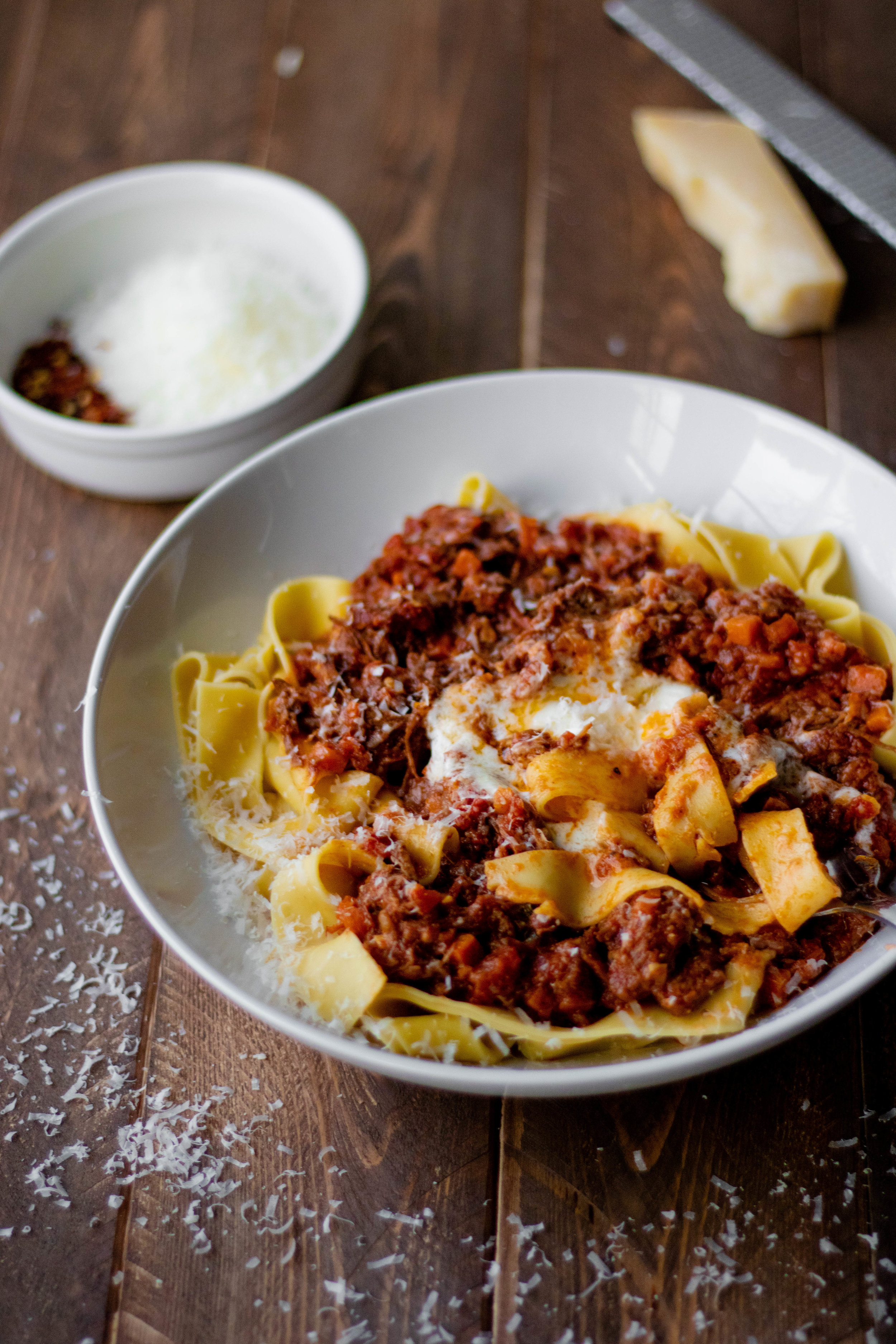 instant pot beef ragu and pappardelle in a white pasta bowl 