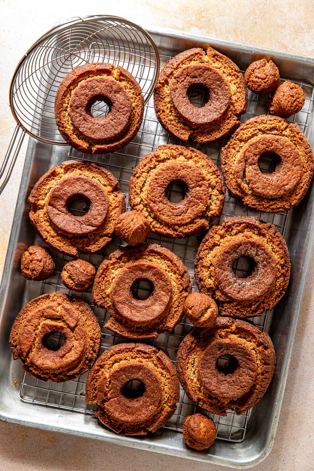 donuts after frying on a baking sheet