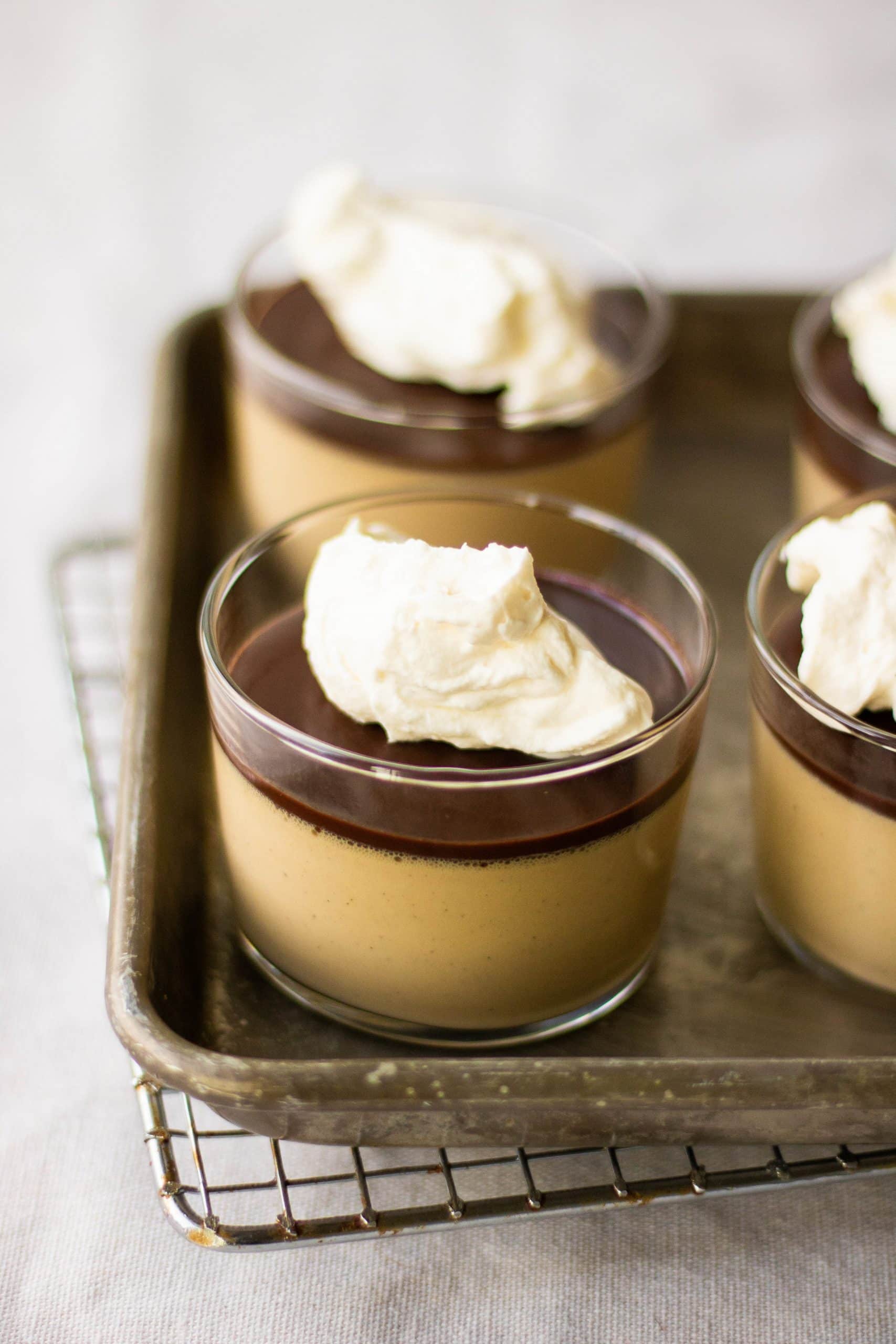 Coffee panna cotta topped with chocolate ganache and mascarpone whipped cream. 