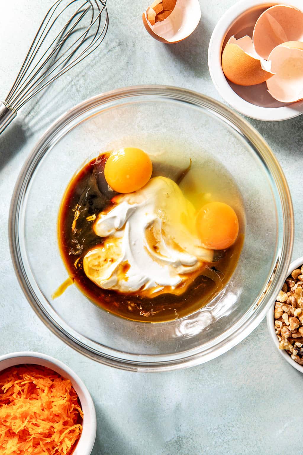 wet ingredients for carrot cake donuts in a mixing bowl