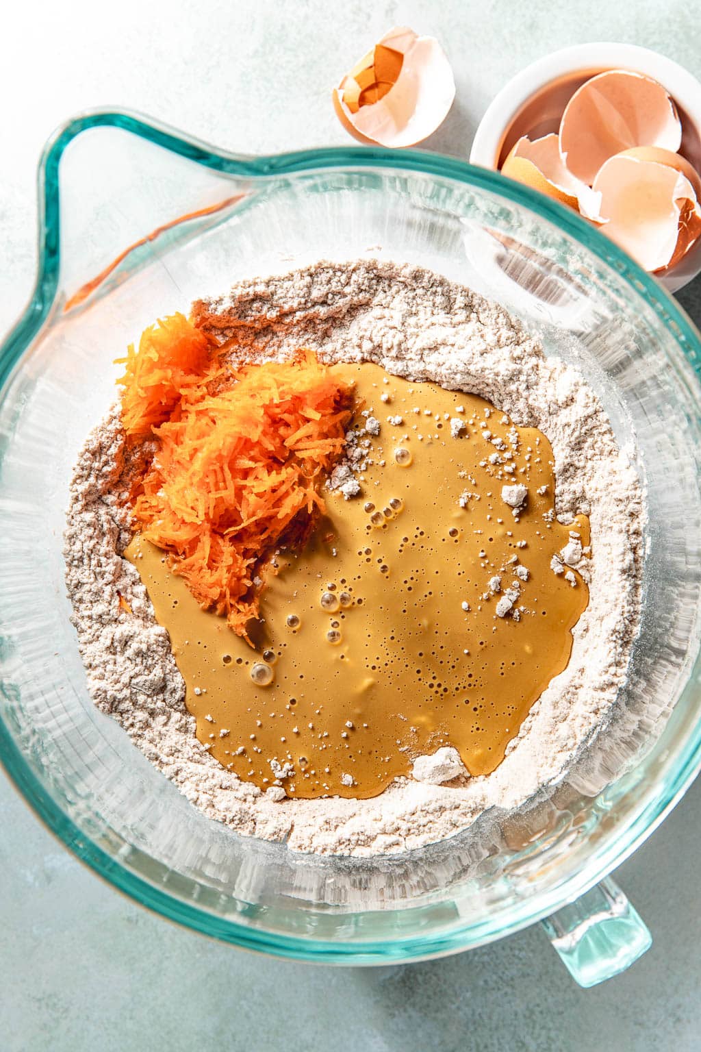 wet ingredients being mixed into the dry ingredients