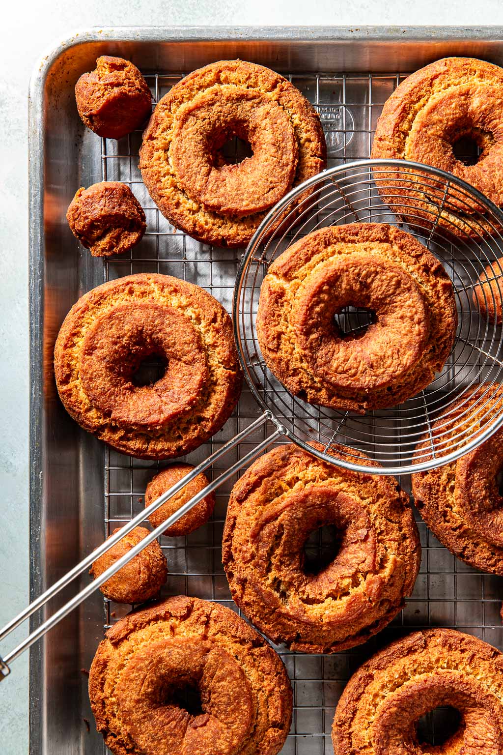 donuts on a baking sheet after frying