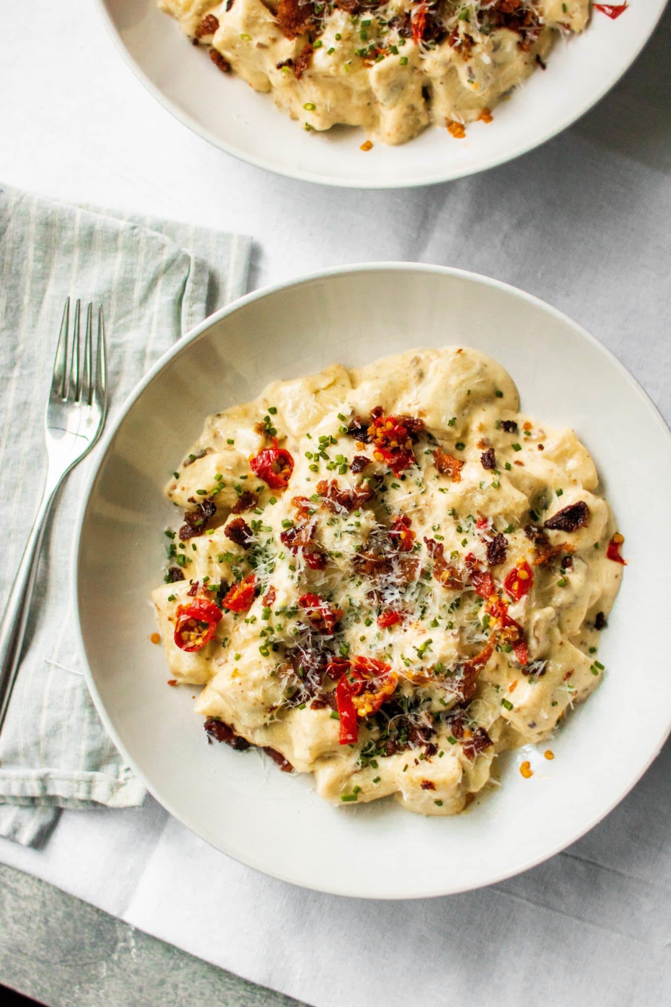 truffle ricotta gnocchi with bacon, calabrian chili and chive