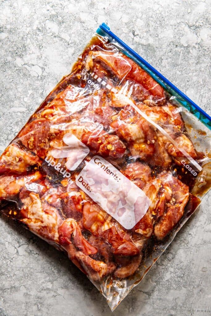 pork in marinade in a large ziplock bag