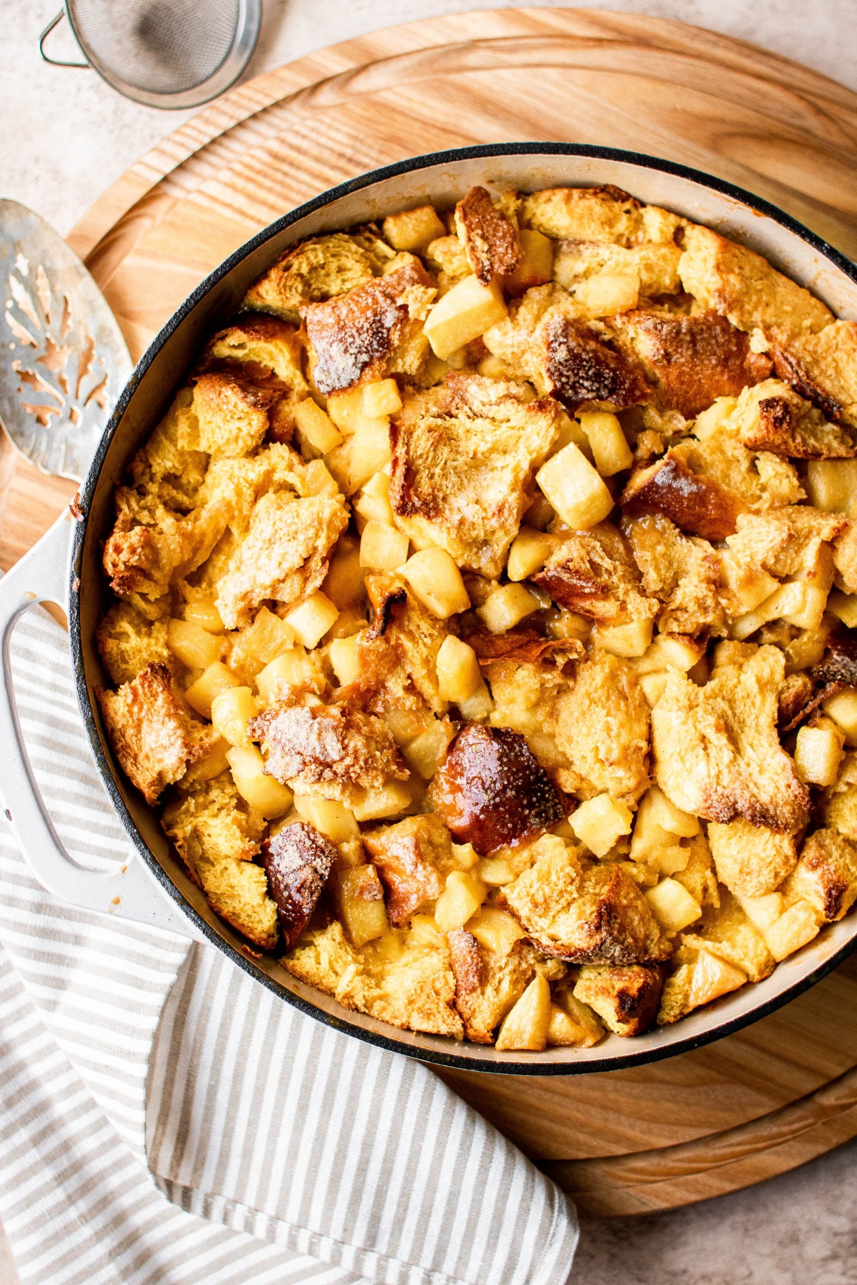 Overnight french toast casserole with apples in a baking dish 
