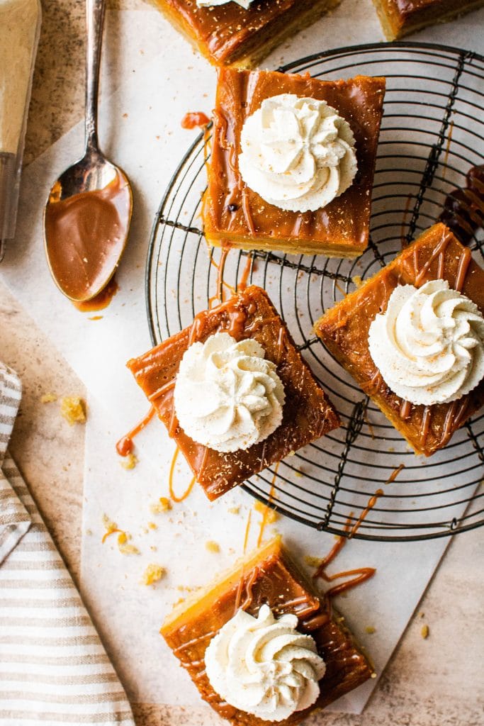 sliced pumpkin pie bars on cooling rack
