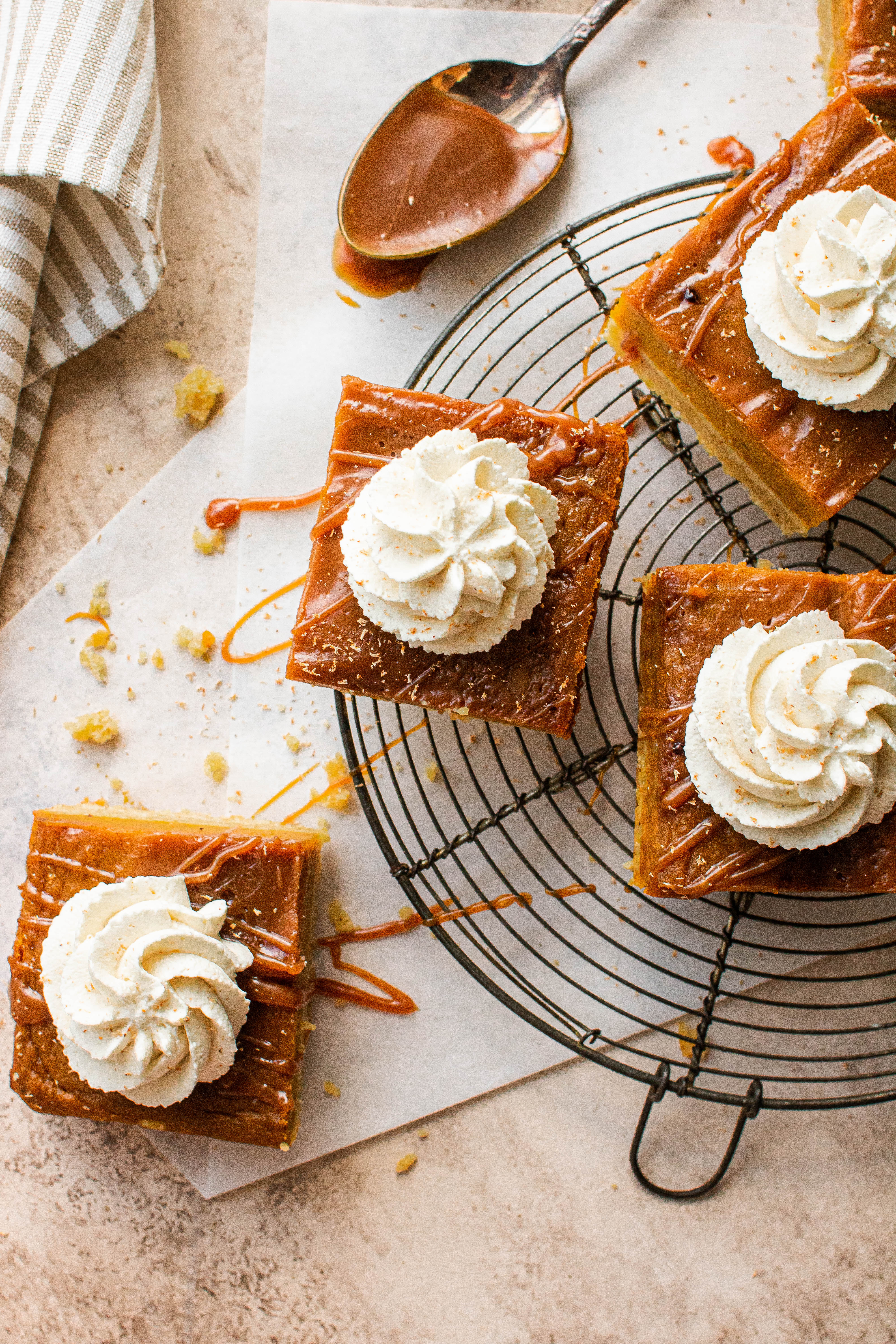 sliced pumpkin pie bars on cooling rack