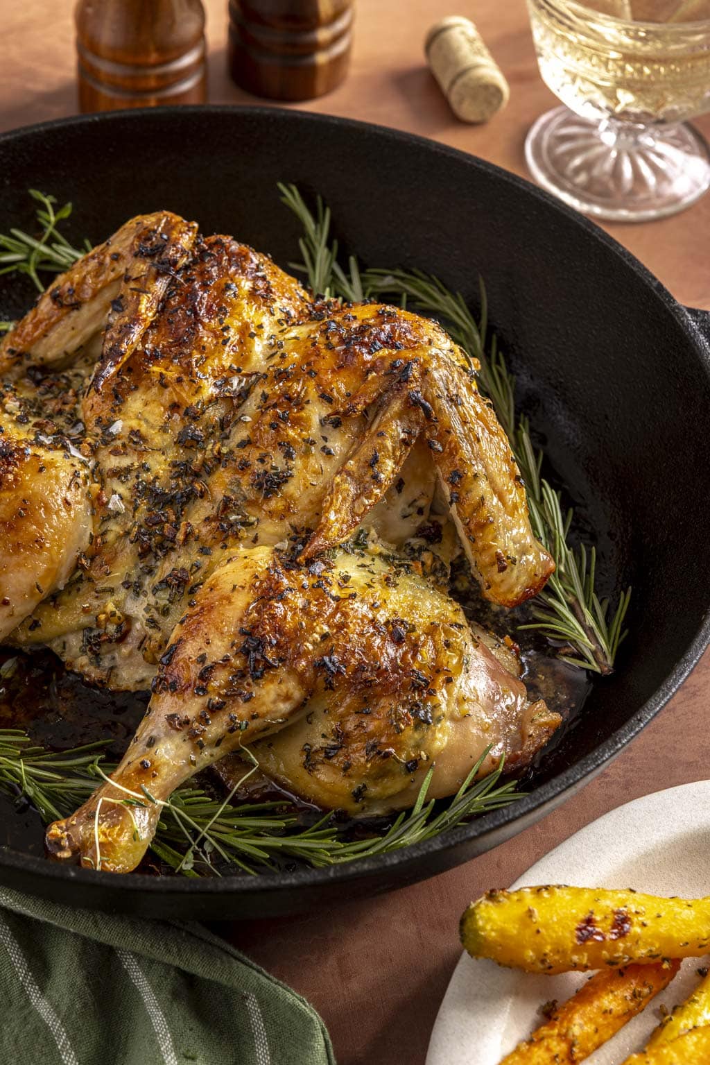 Juicy herb roasted chicken in a large skillet