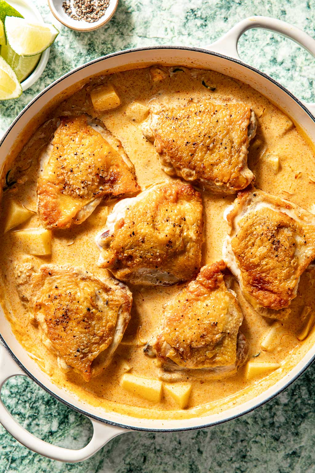 Chicken in coconut milk curry sauce before cooking in the oven