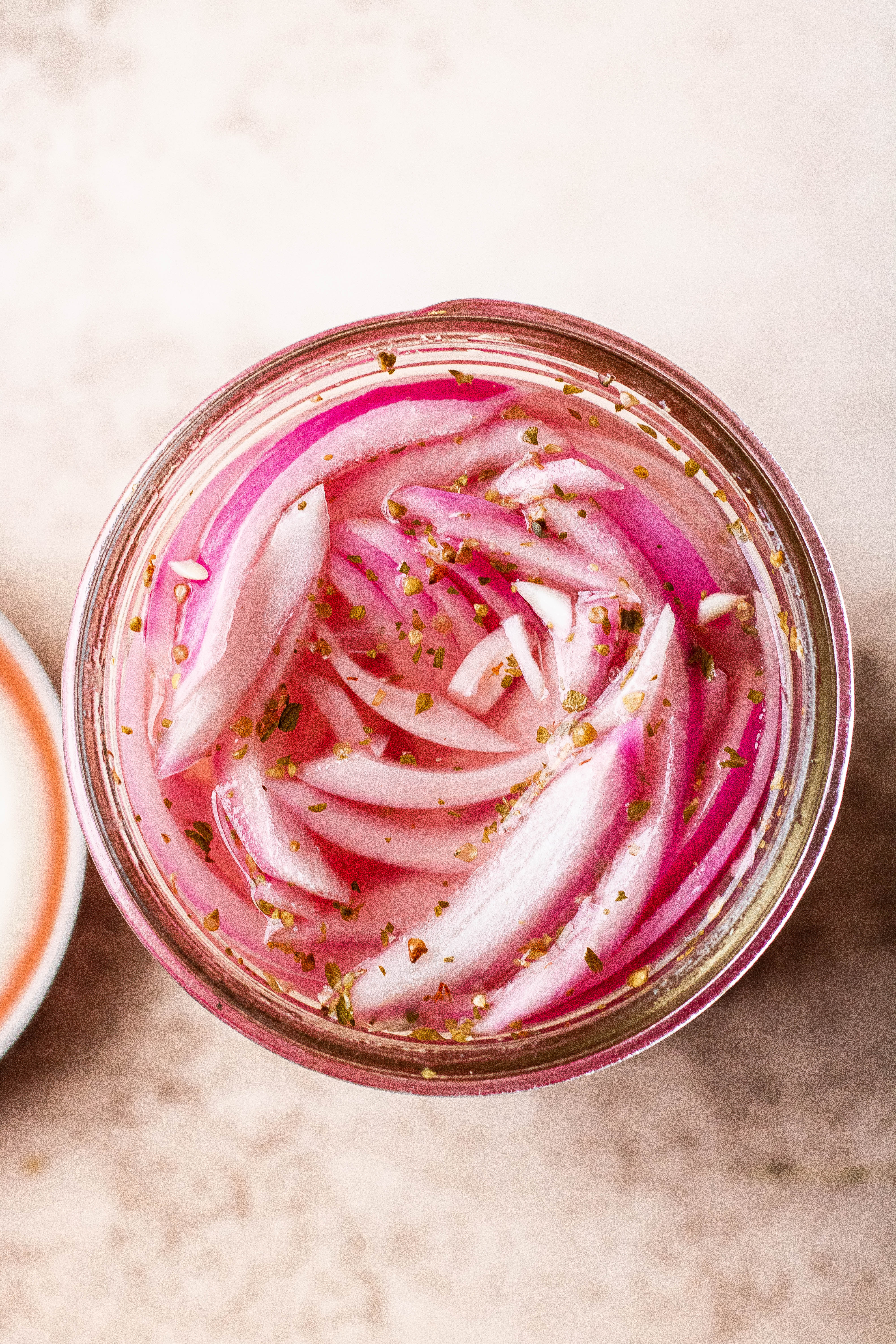 Top view of quick pickled red onions in a jar 