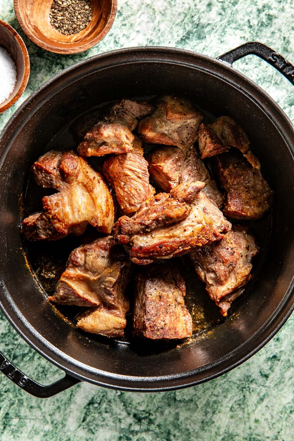 pork butt searing in a dutch oven