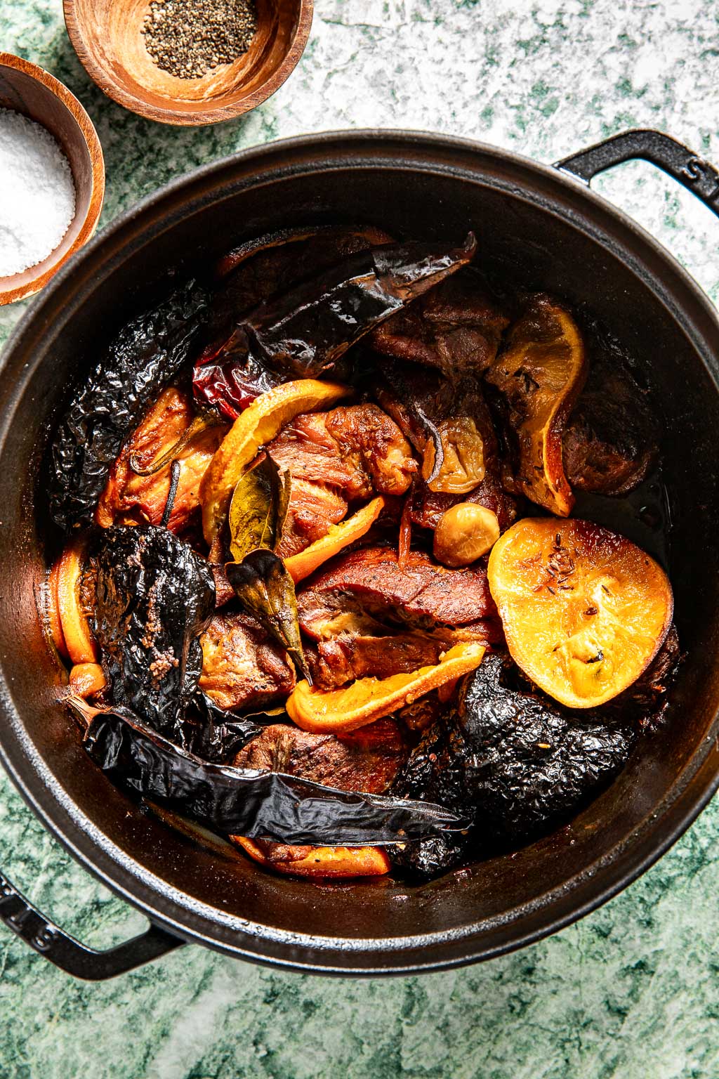 carnitas in a dutch oven after braising in the oven