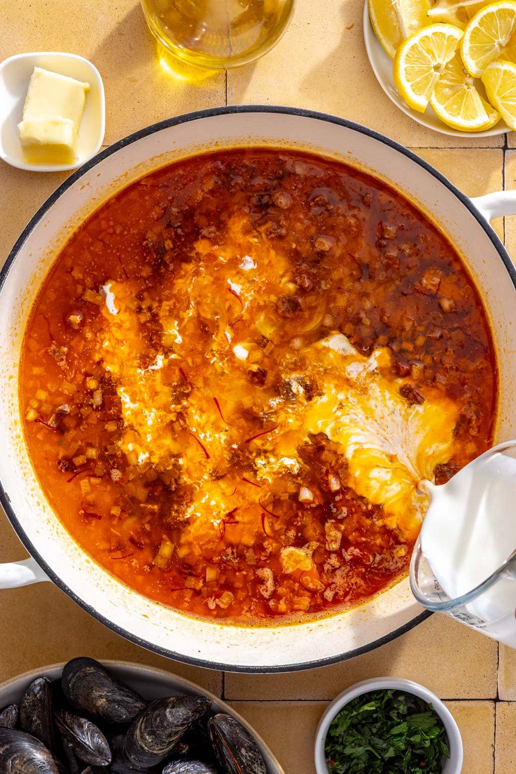 Heavy cream being added to the wine