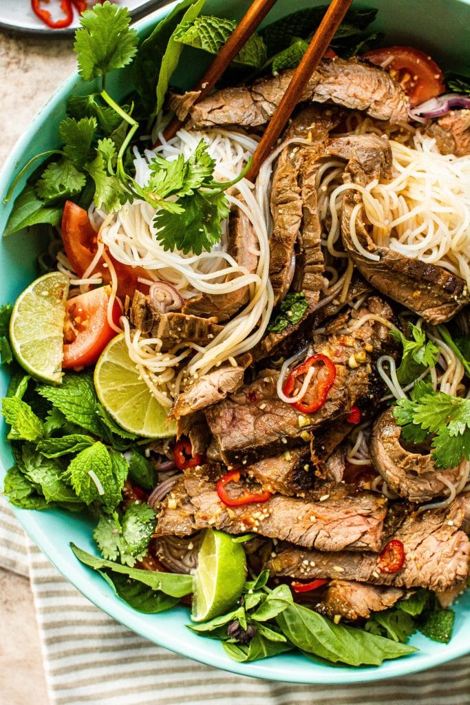 thai beef and noodle salad in a bowl 