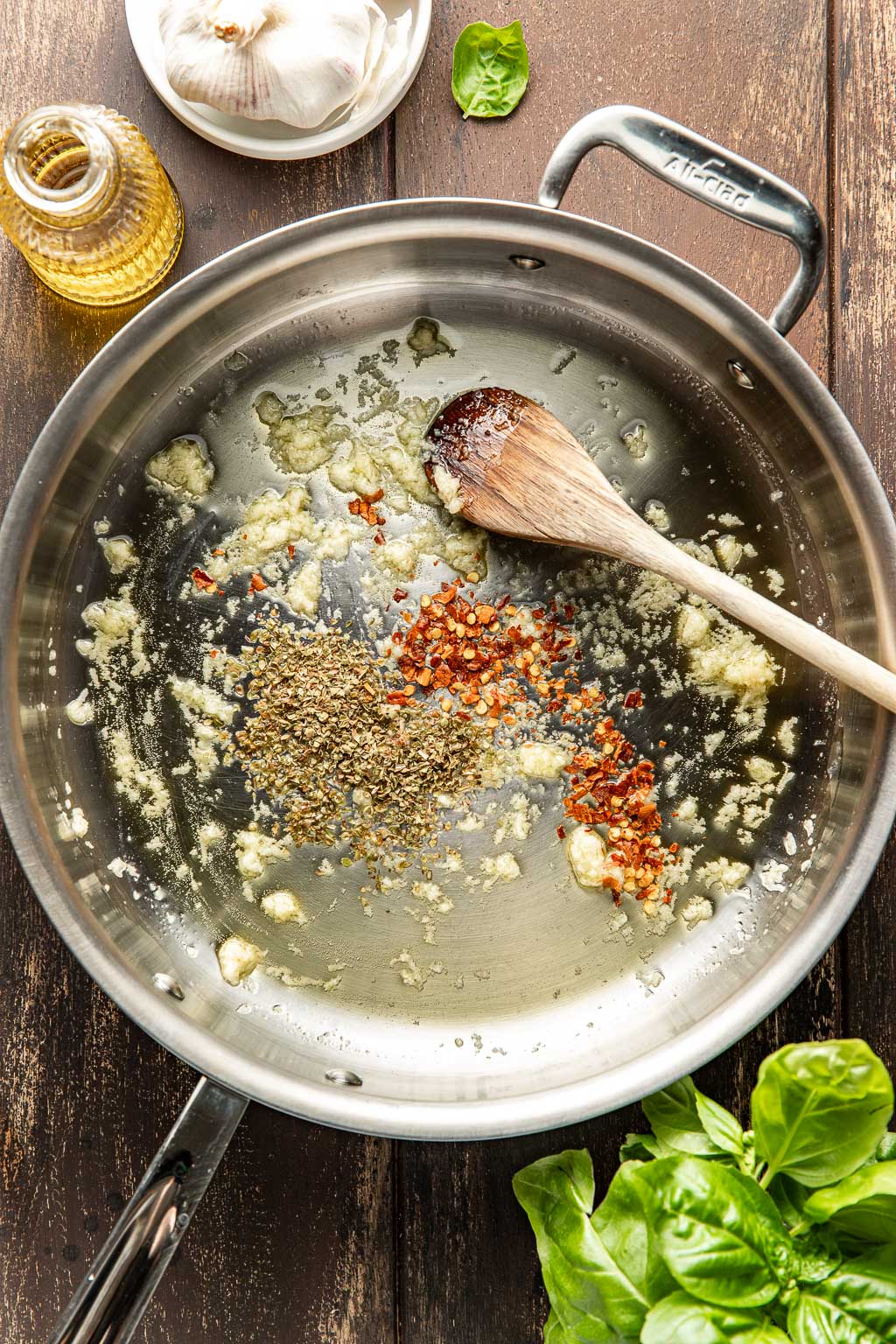 Garlic and spices in olive oil in a skillet