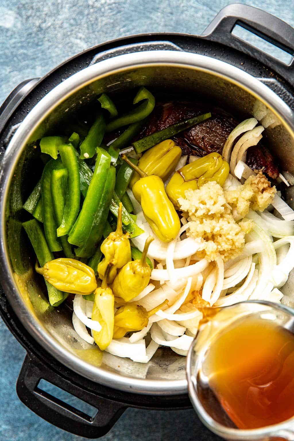 Beef and ingredients in instant pot before cooking