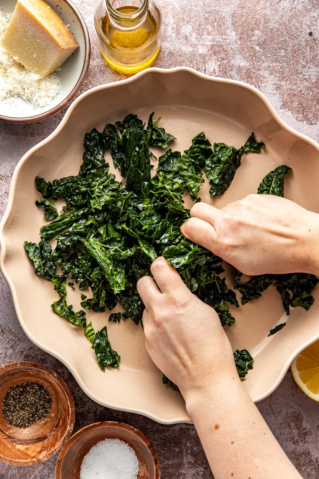 kale greens being massaged in a bowl