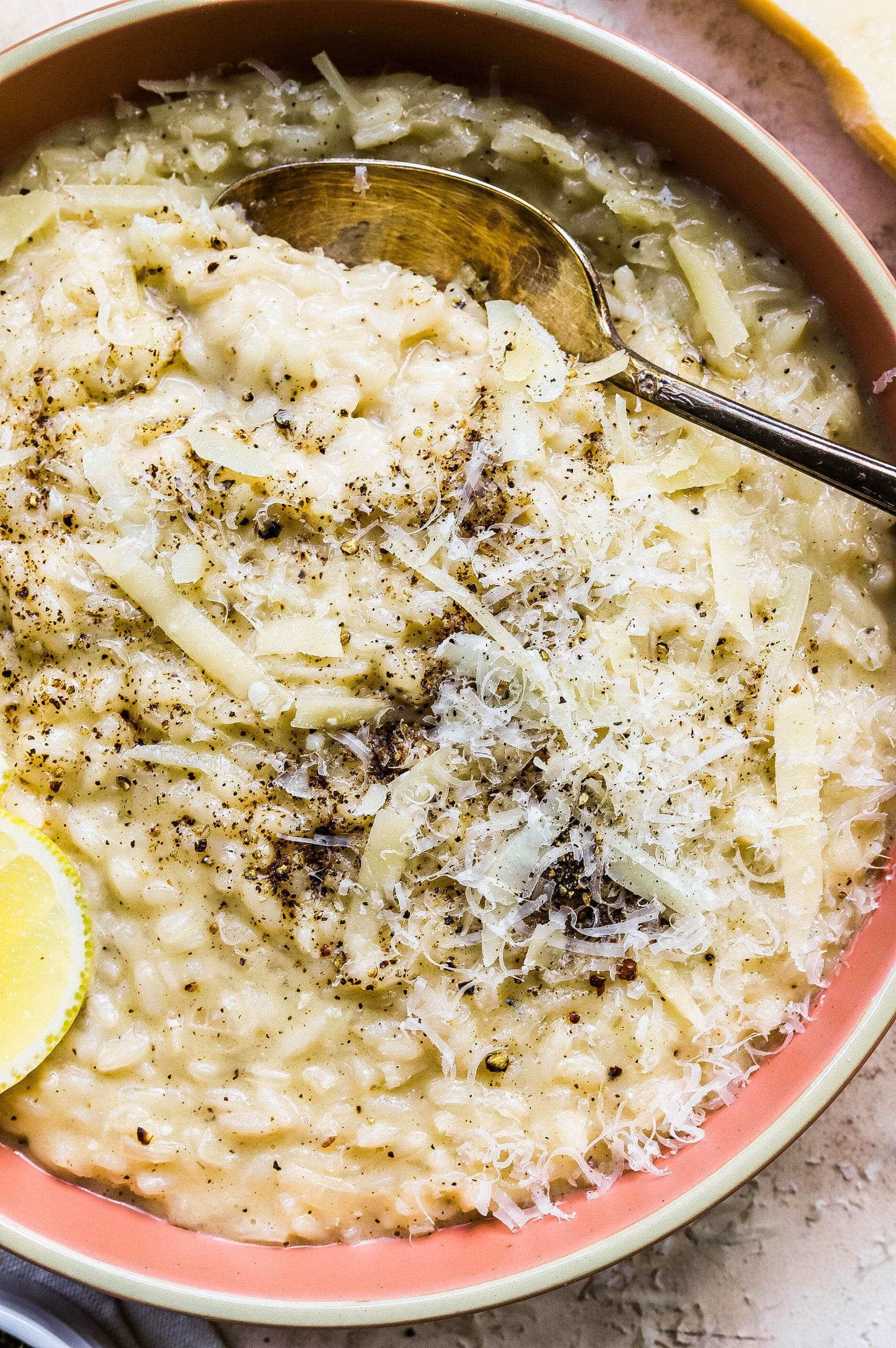 cacio e pepe risotto, garnished with lemon 