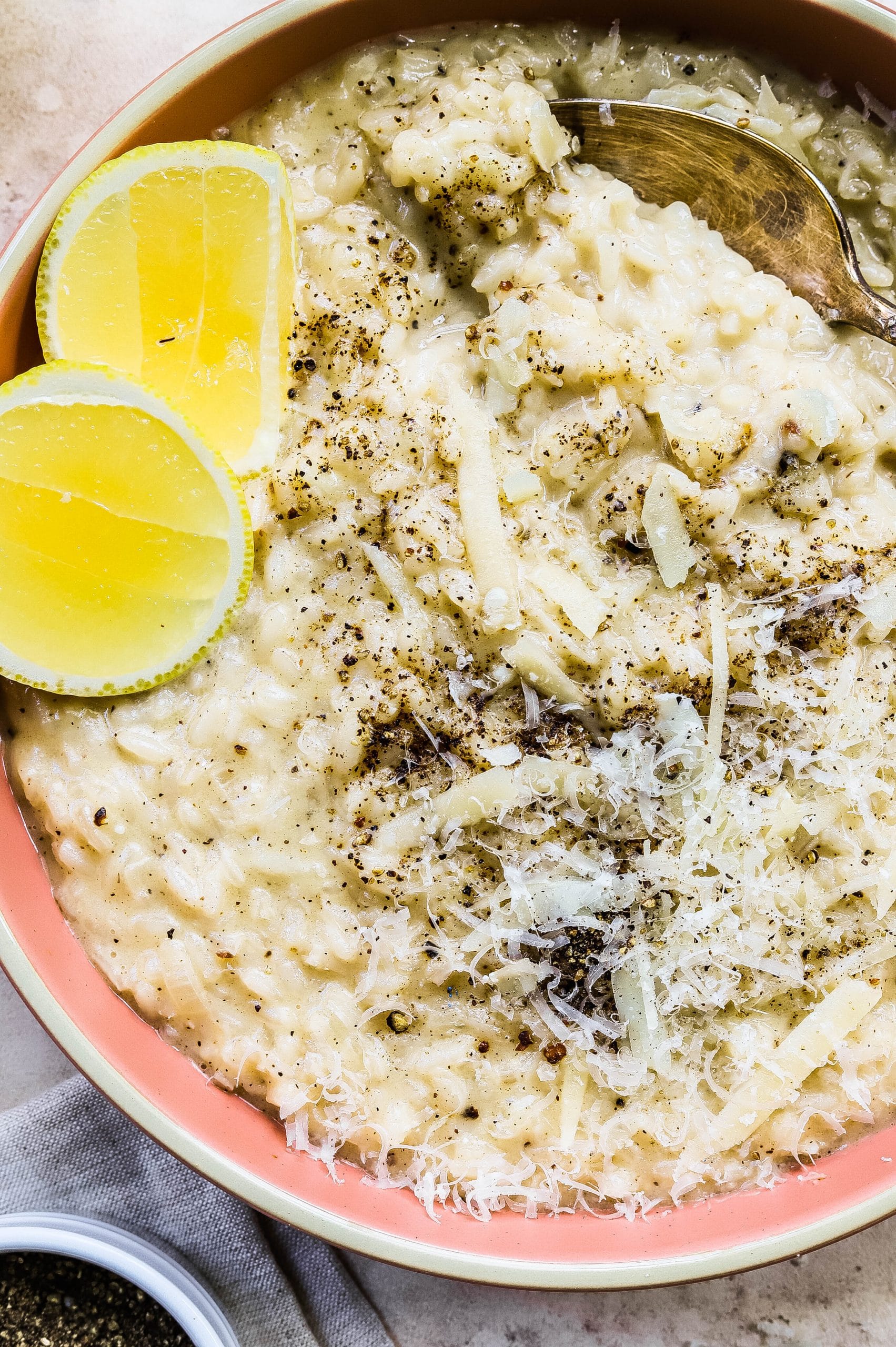 Cacio e pepe risotto topped with Pecorino, lemon, and black pepper. 