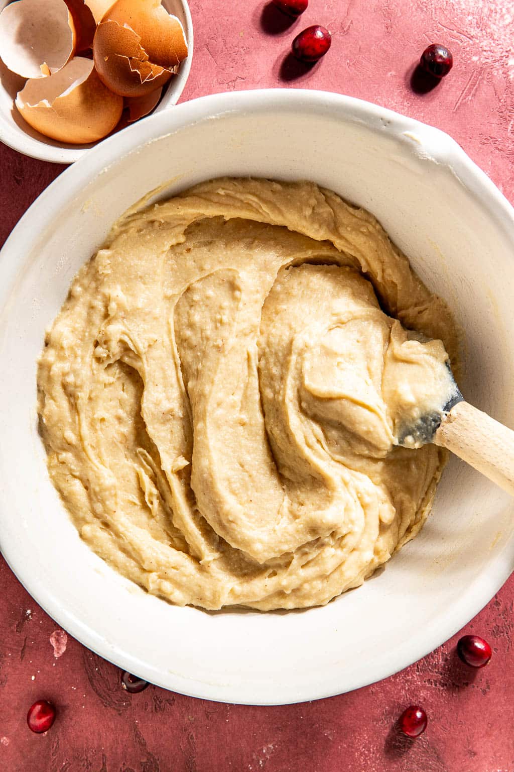 cake batter after being mixed in a white mixing bowl