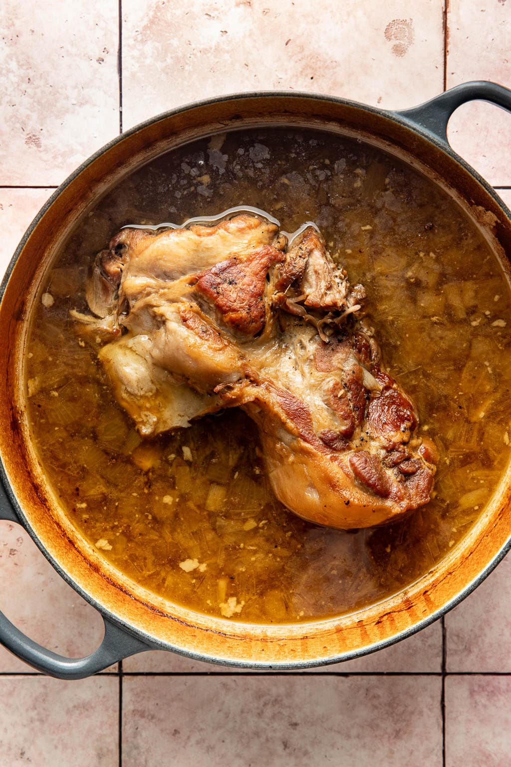 pork shoulder in a dutch oven after braising
