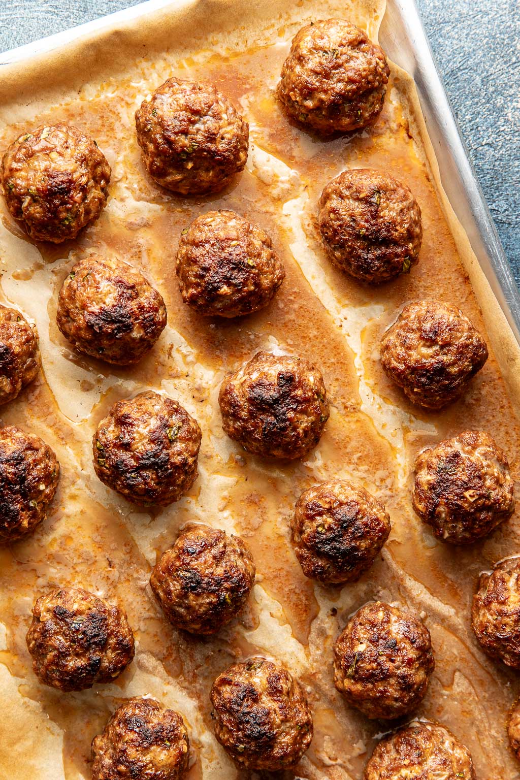 meatballs on a baking sheet after being broiled