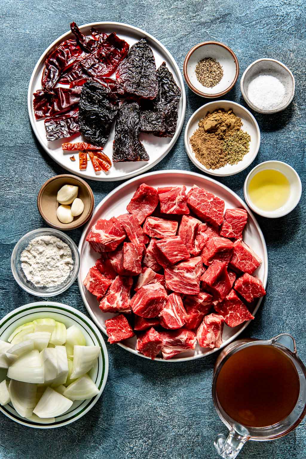 chile colorado ingredients laid out on a blue background