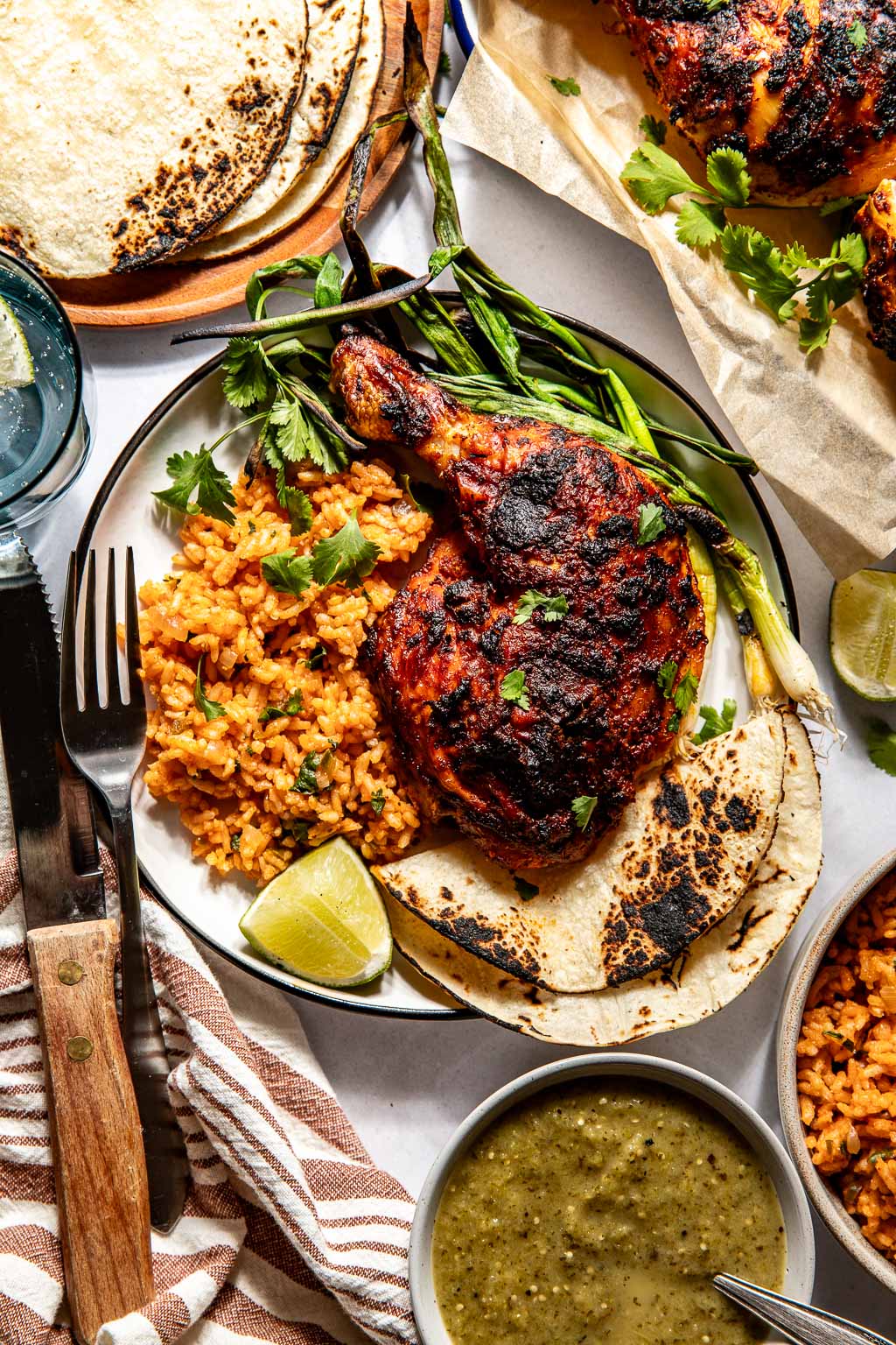 pollo asado on a plate with mexican rice