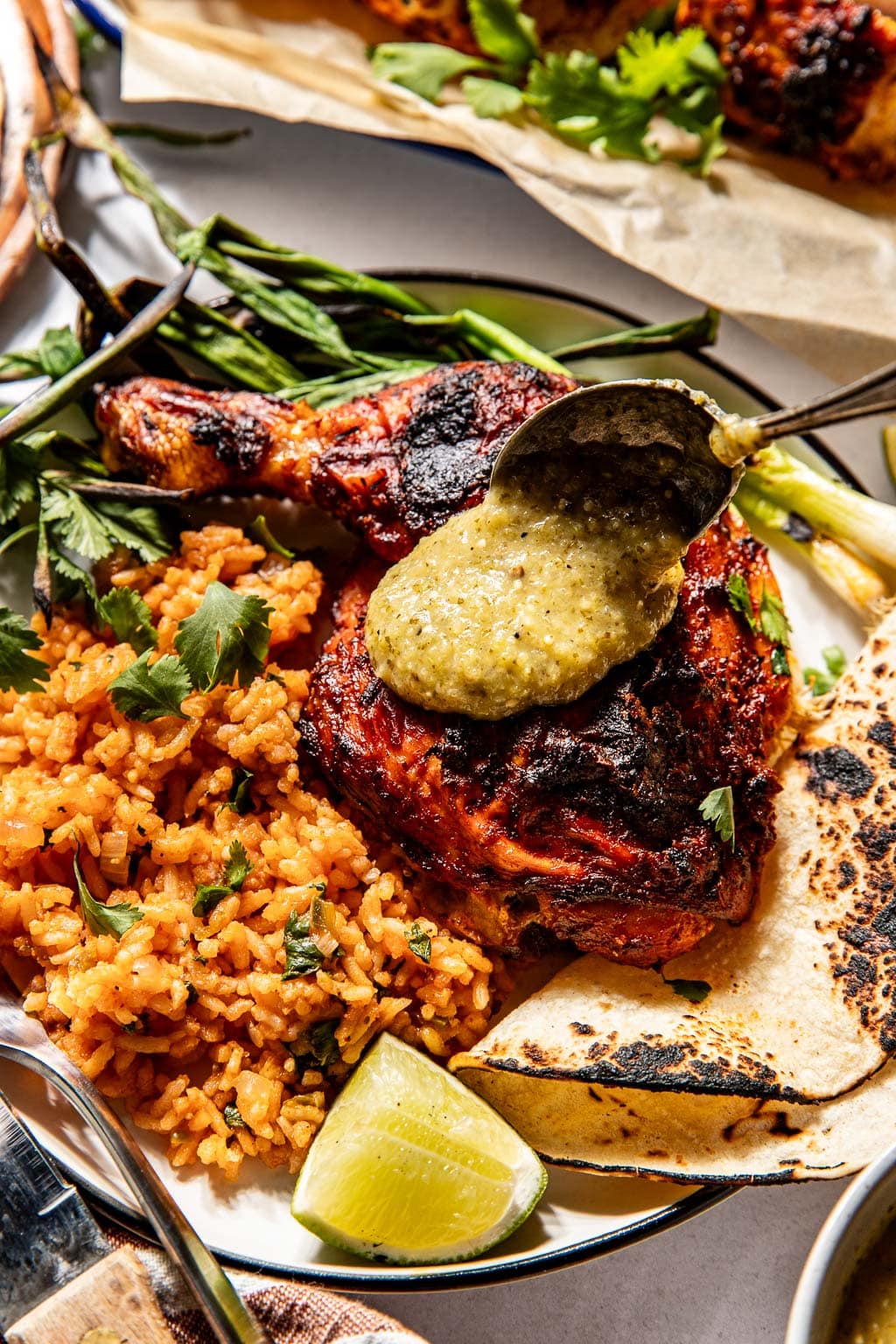 juicy pieces of pollo asado topped with salsa verde