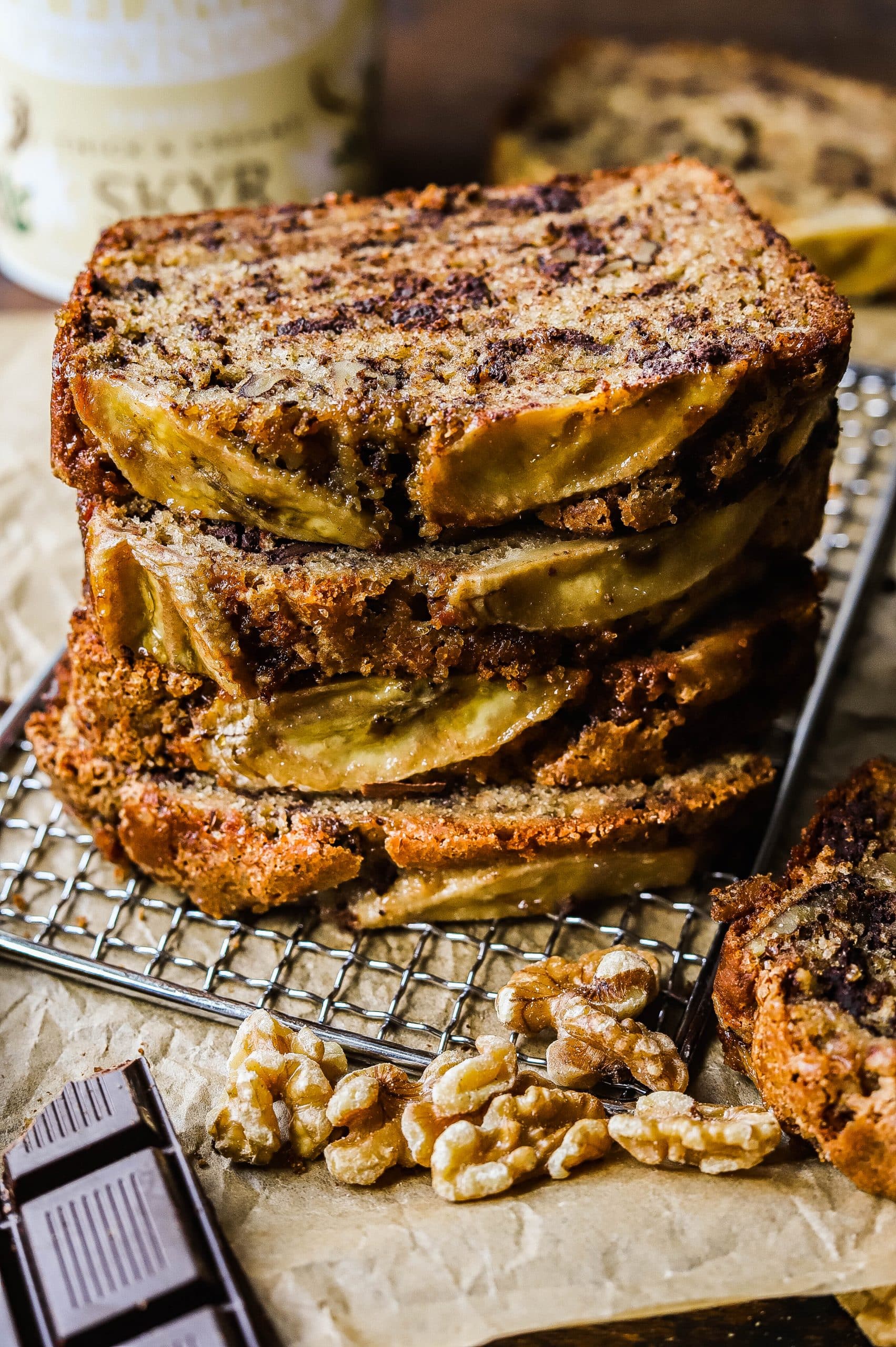 stacked slices of yogurt banana bread with chocolate chips and nuts