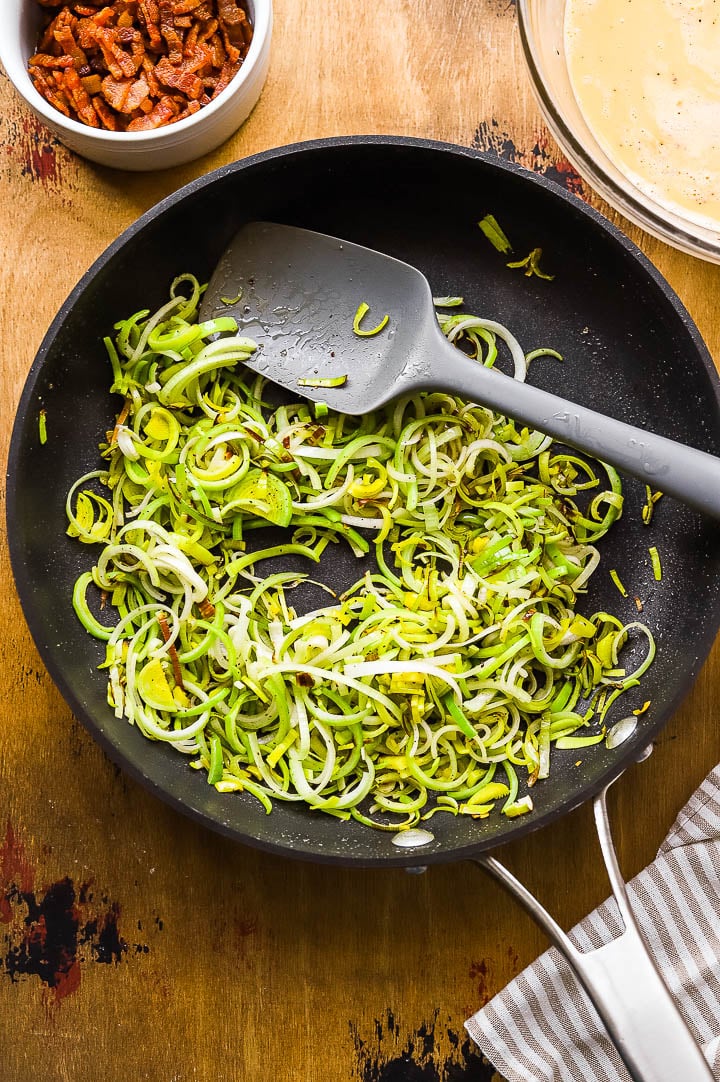 leeks cooking in a skillet