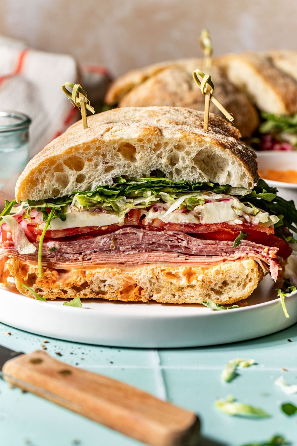 shareable italian sandwich slice on a plate