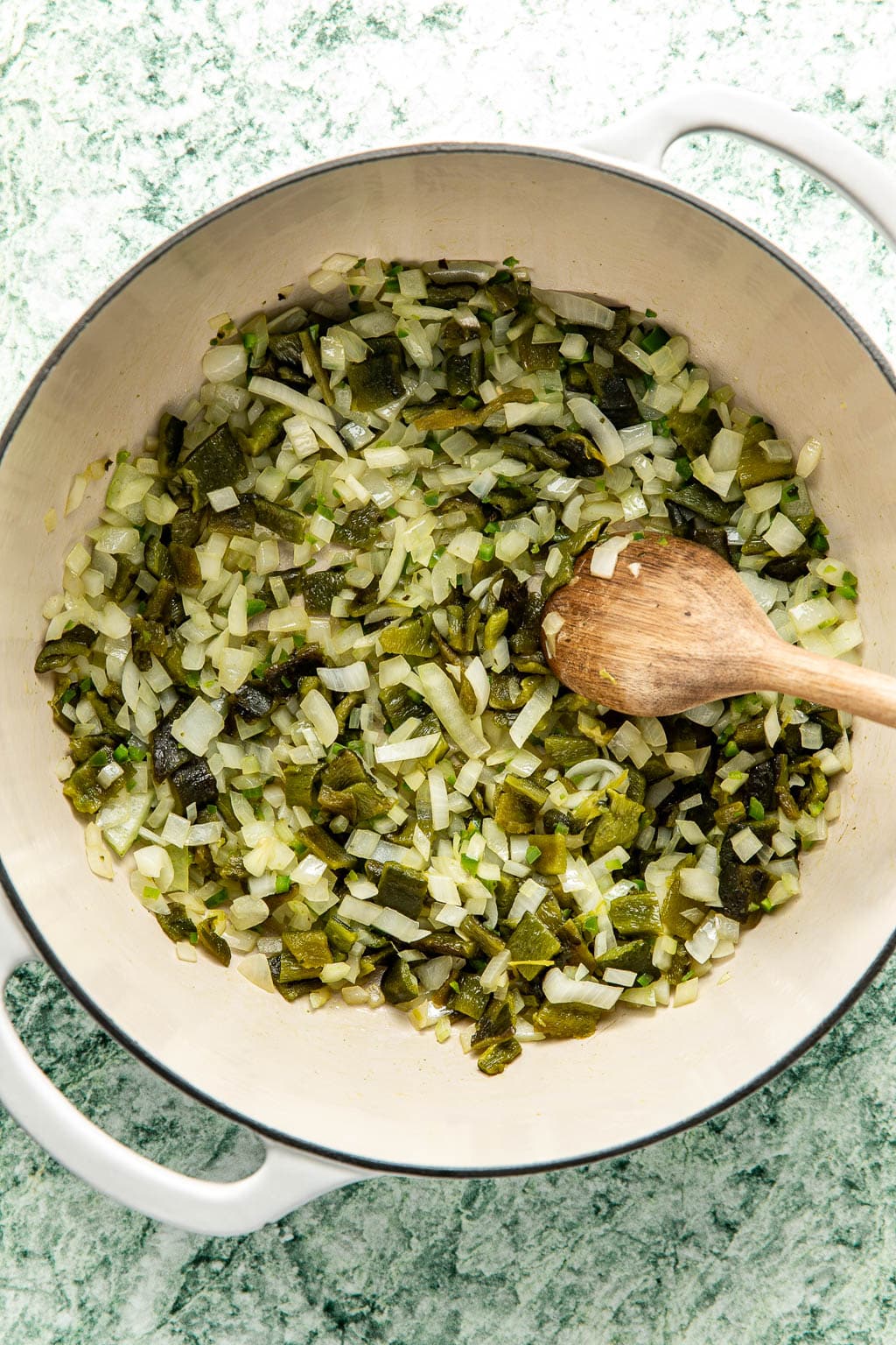 onions and diced poblano peppers in a dutch oven