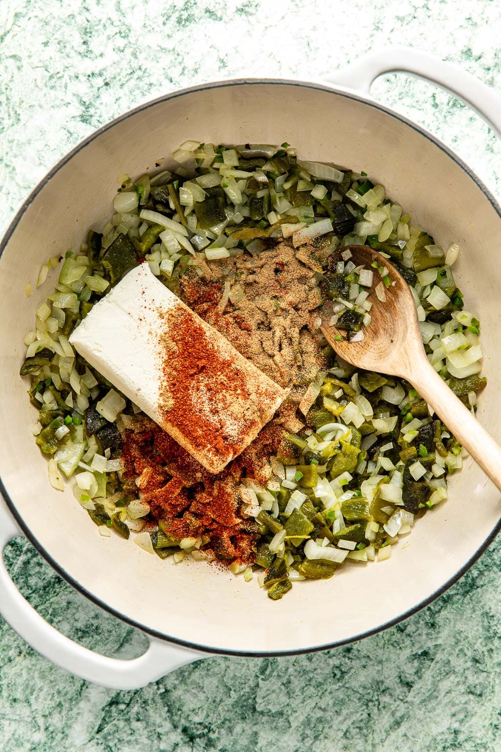 cream cheese and spices with the onions and poblanos