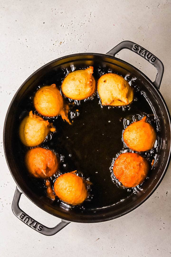 frying lemon fritters in oil