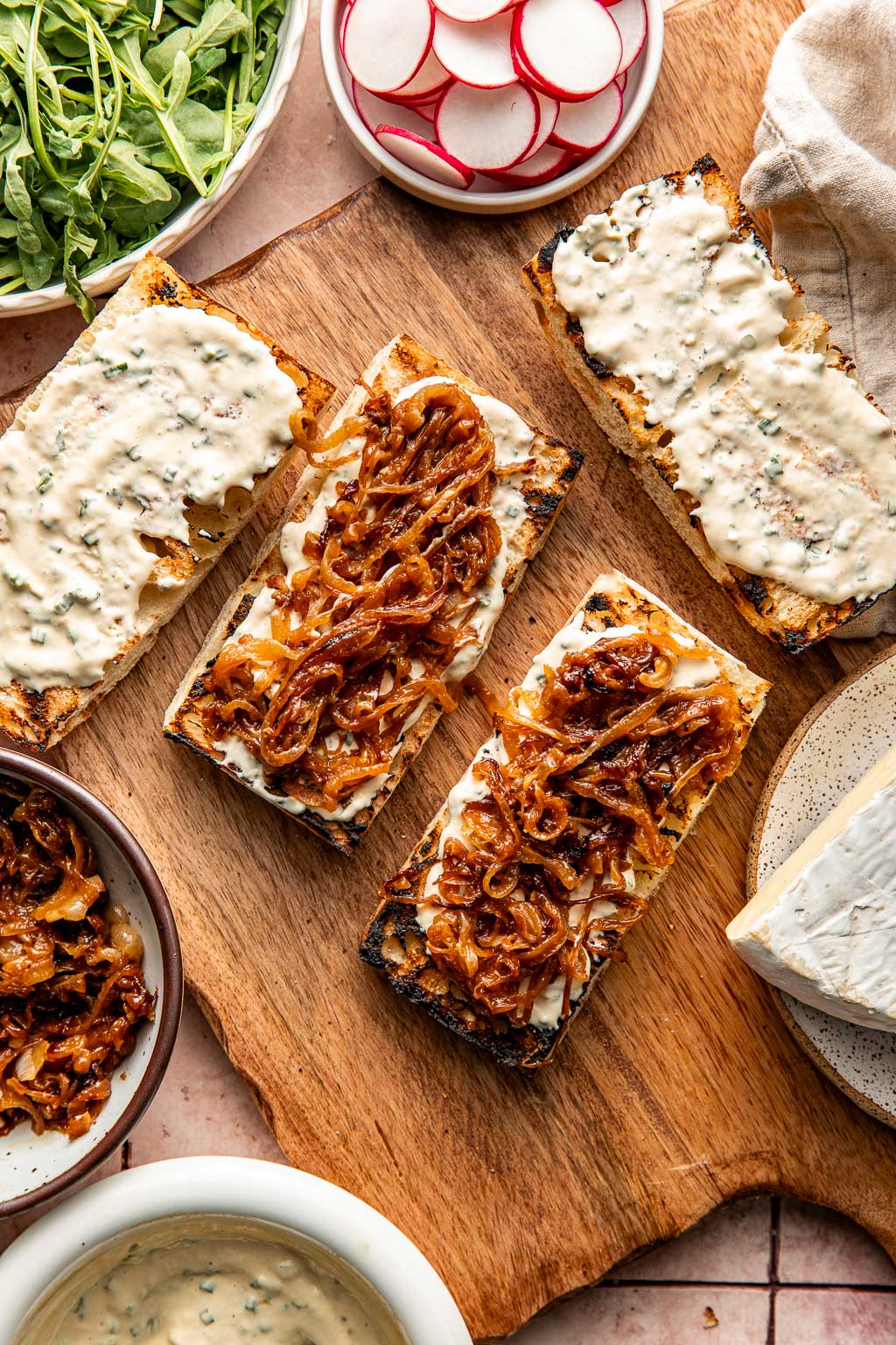 layering caramelized onion on sandwiches