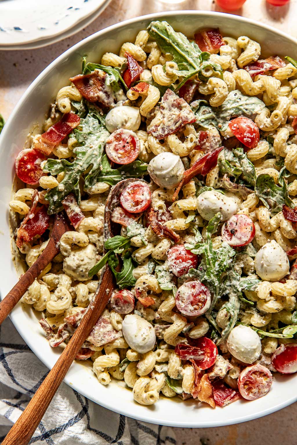 creamy pesto pasta salad in a serving bowl