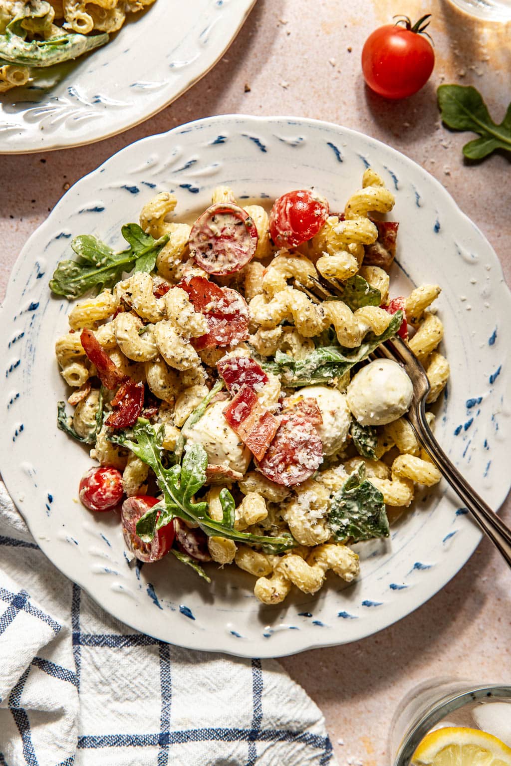 a single serving of pesto pasta salad on a plate