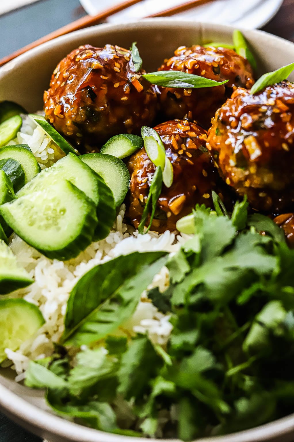 sesame ginger meatballs with rice and cucumber 