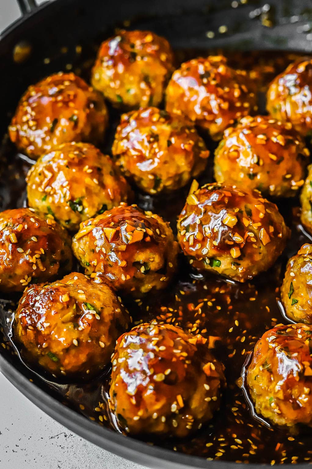 soy ginger meatballs in a skillet 