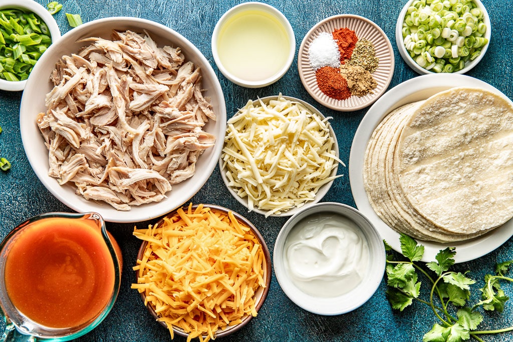 red chicken enchilada ingredients laid out