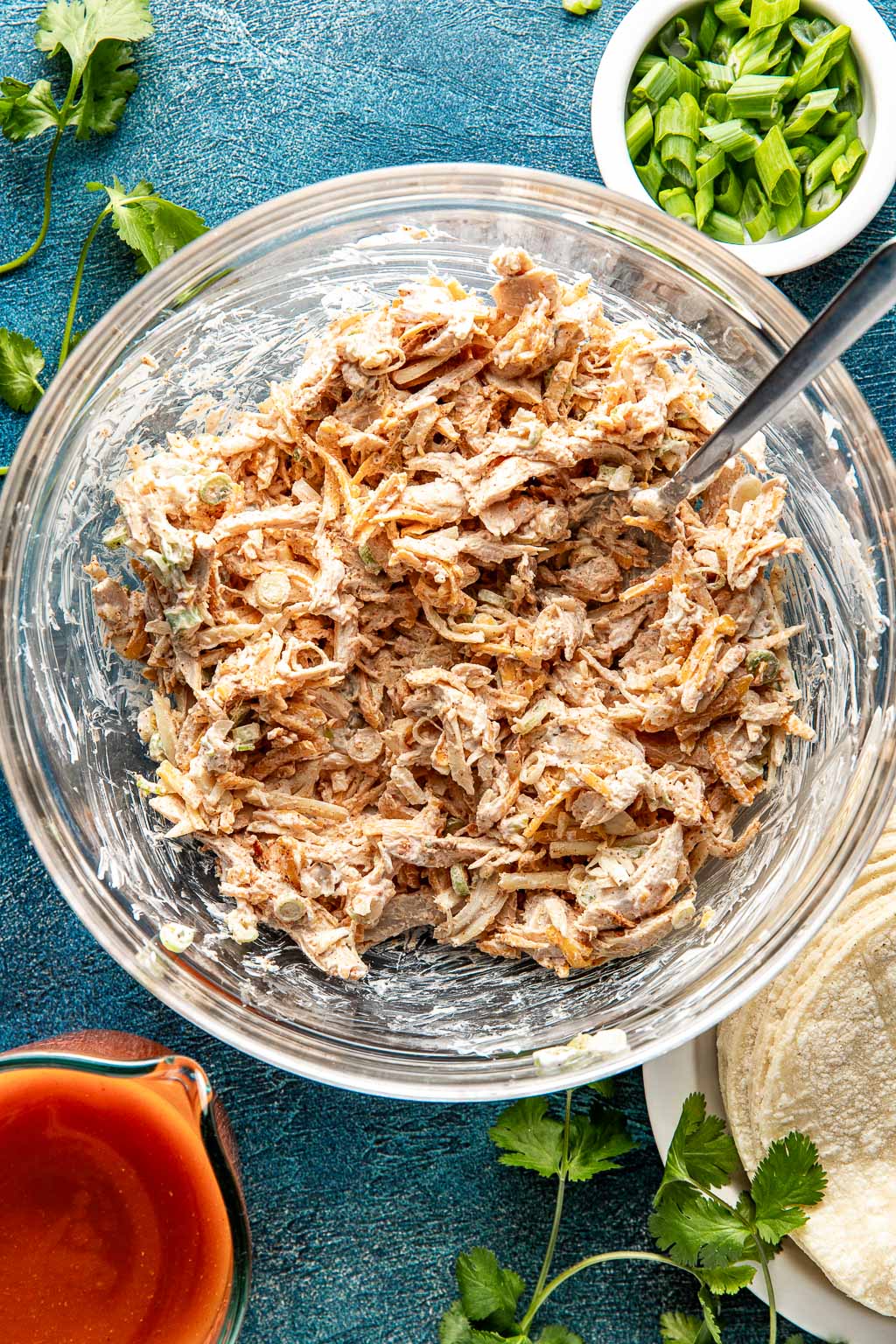 chicken enchilada filling in a mixing bowl after mixing