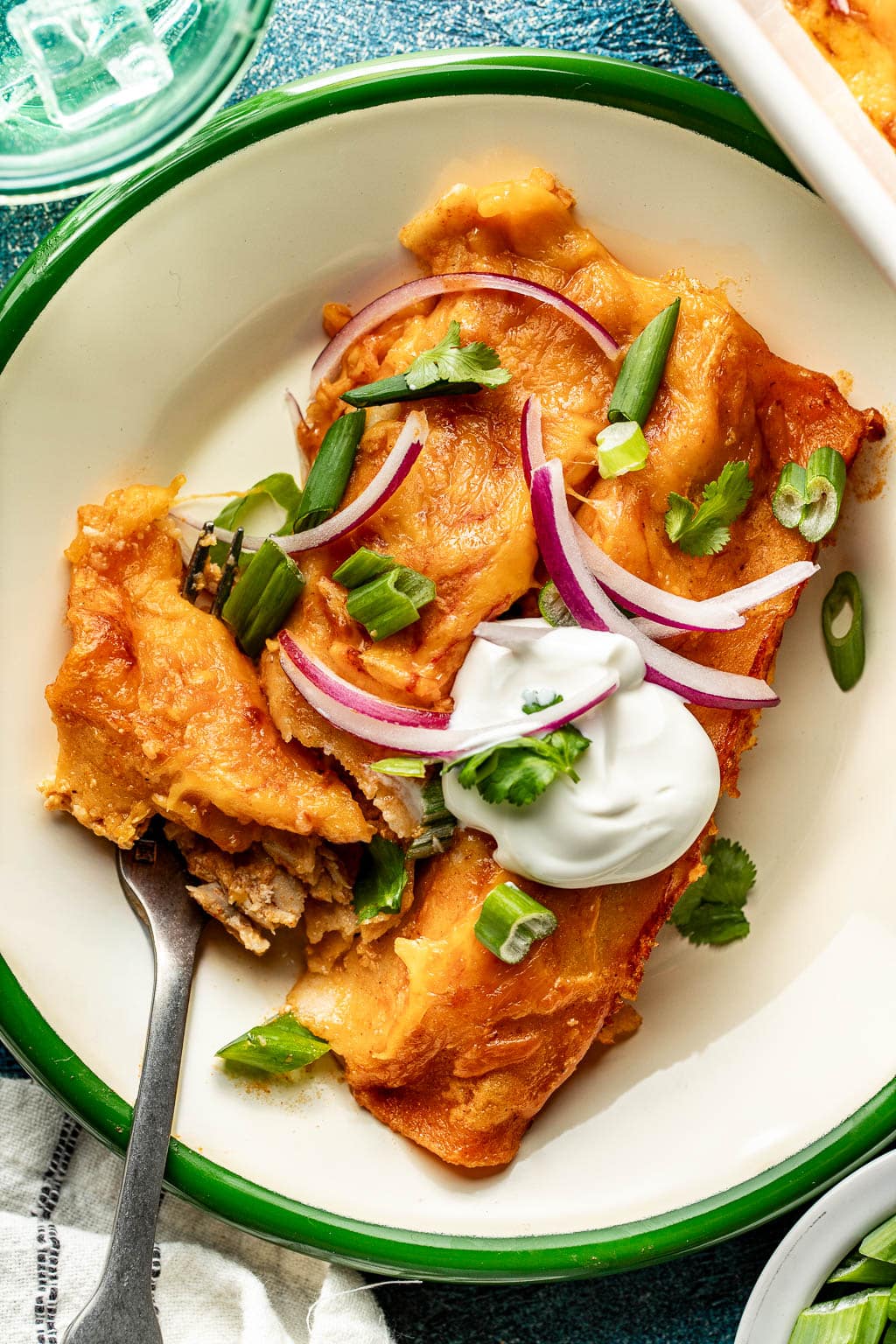 red chicken enchiladas on a plate