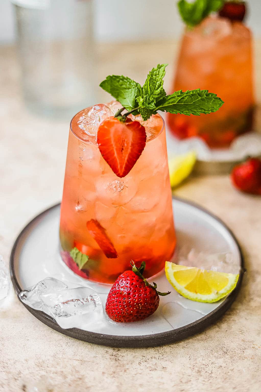 A strawberry lemonade cocktail in a glass 