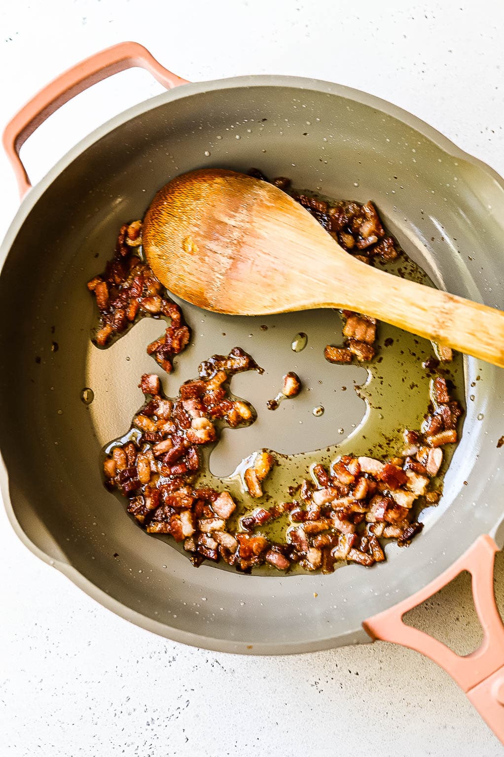 Pancetta cooking in a skillet 