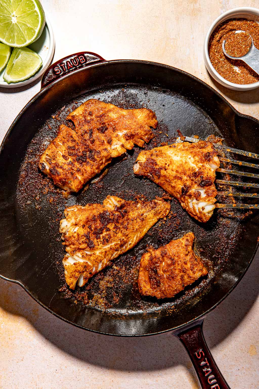 blackened fish in a skillet after cooking