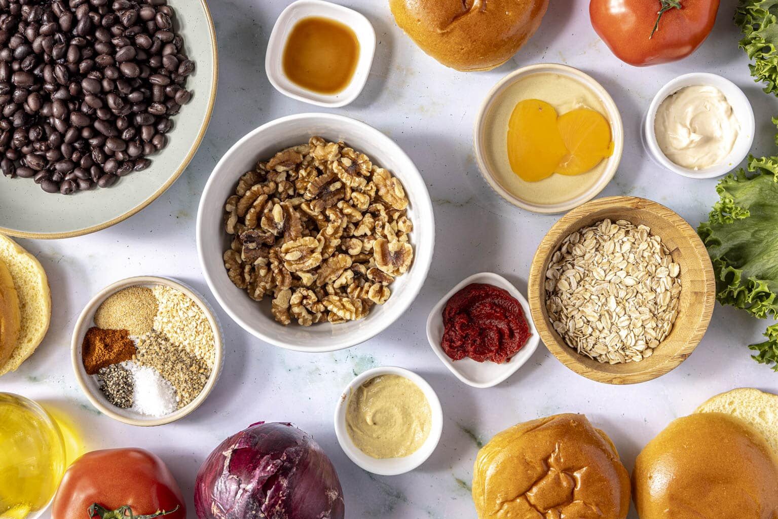 black bean walnut burger ingredients laid out on a white background
