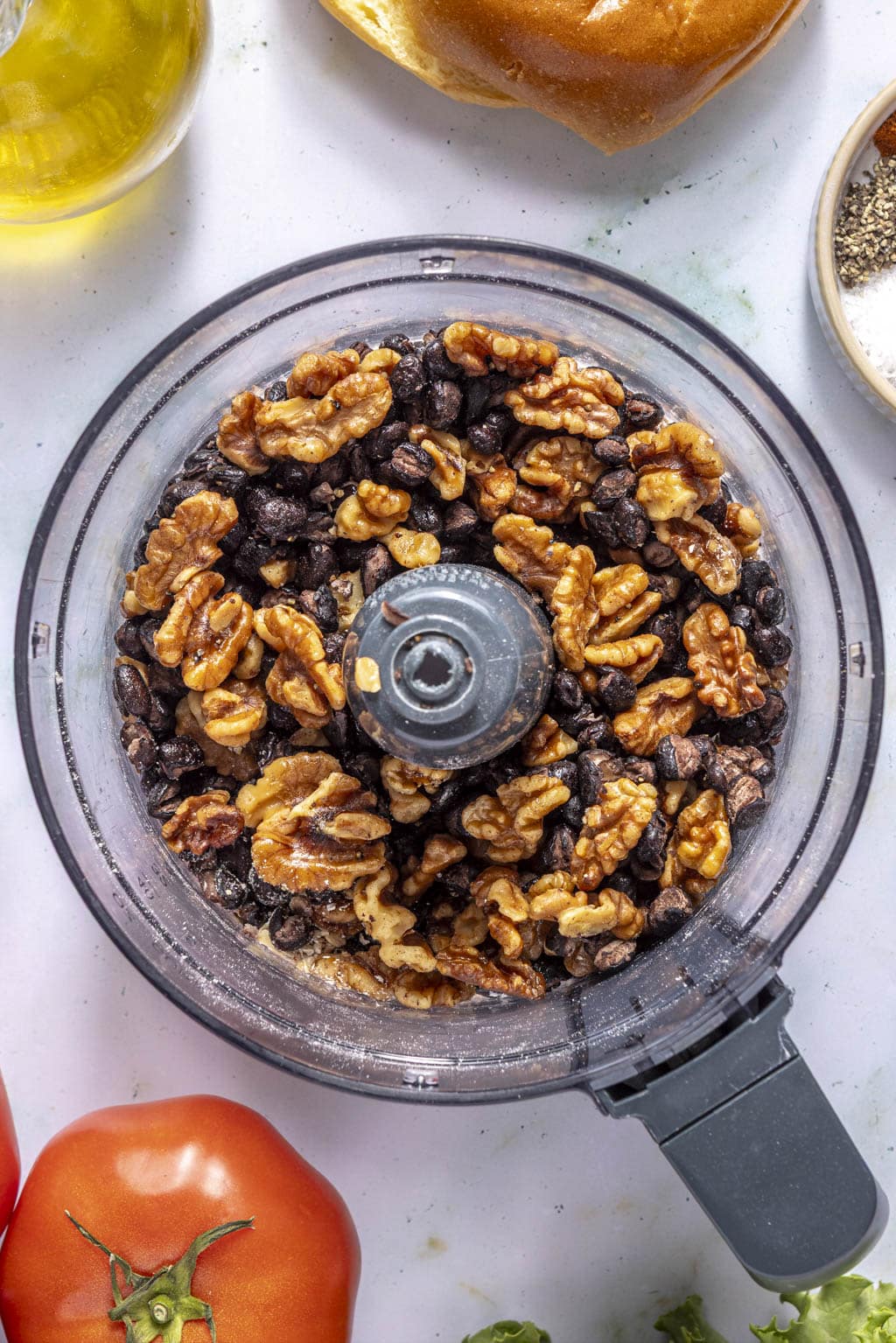 walnuts and beans in a food processor bowl